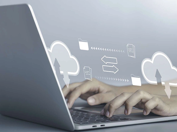 Hands using a laptop for download