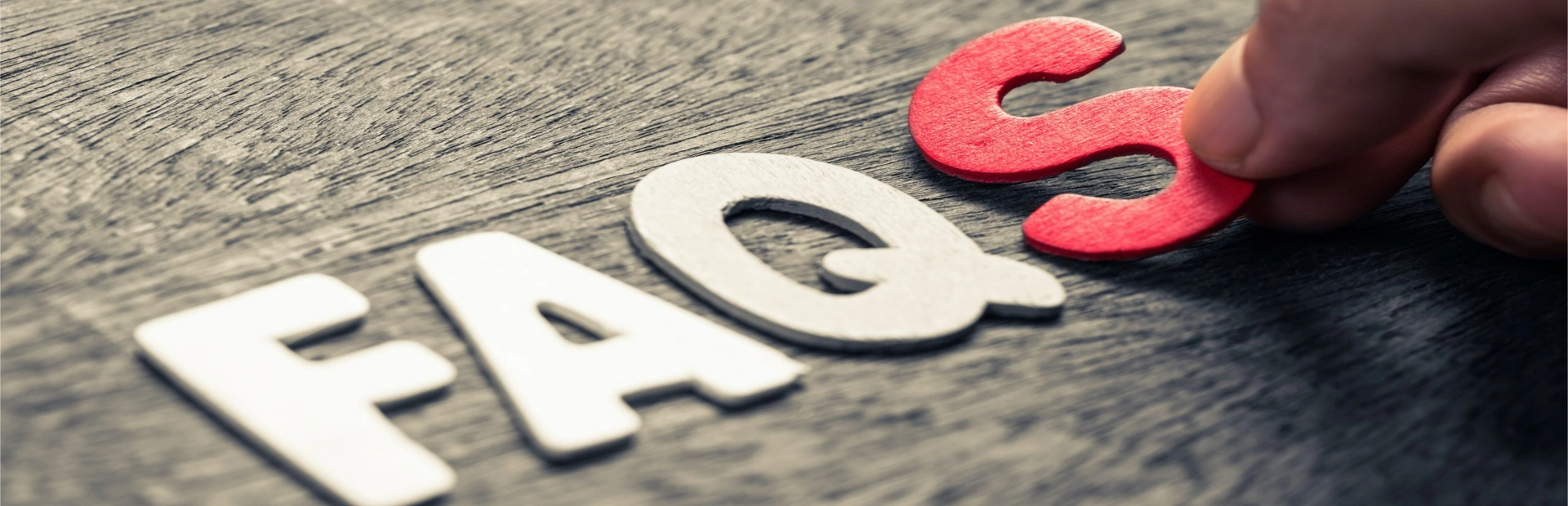 FAQS letters on a table