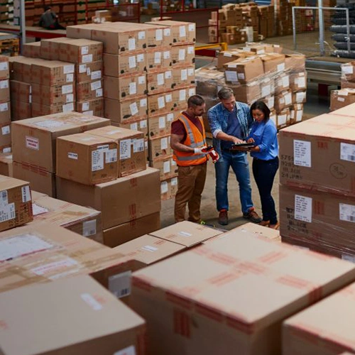 Three staff working in the warehouse