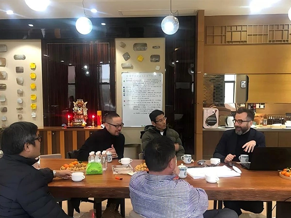 Company leaders meeting with overseas clients