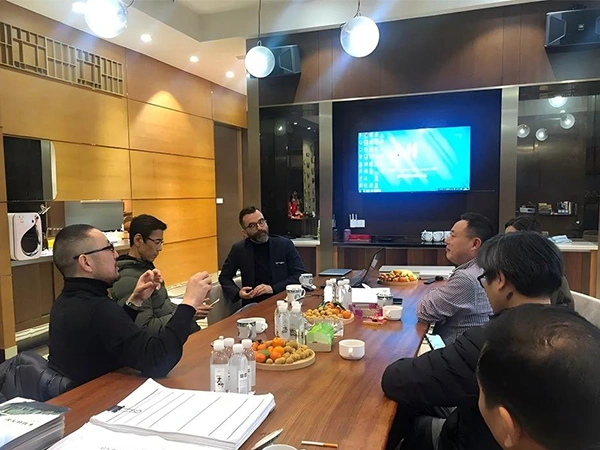 Company leaders meeting with overseas clients